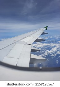 A wing of plane in the sky