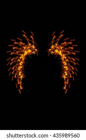 Wings fire of imagination and creativity wings made of fire Beauty fairy tale.On a black background abstract style.