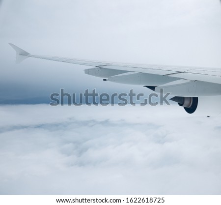 Wings move through the clouds, causing turbulence and leaving a trail.