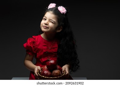 Winked Eye Girl With Pomegranates Basket In Front Of Her. Happy Yalda Iranian Celebration Theme