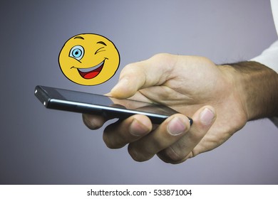 Winking and smiling emoticon