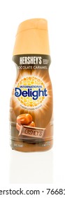 Winneconne, WI - 1 December 2017:  A Bottle Of International Delight Coffee Creamer In Hershey's Chocolate Caramel Flavor On An Isolated Background.