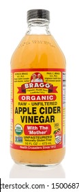 Winneconne, WI - 10 September 2019: A bottle of Bragg apple cider vinegar with mother on an isolated background.