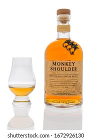 Winneconne,  WI - 12 March 2020:  A Bottle Of Monkey Shoulder Blended Malt Scotch Whisky With A Glass Served Neat On An Isolated Background.