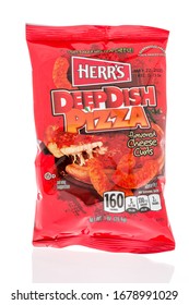 Winneconne,  WI - 17 March 2020:  A Package Of Herrs Deep Dish Pizza Cheese Curls On An Isolated Background.