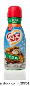 Winneconne, WI -21 December 2021: A Package Of Neslte Coffee Mate Pumpkin Spice Flavor Coffee Creamer On An Isolated Background