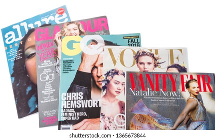 Winneconne, WI -  3 April 2019: A collection of fashion magazines including allure, glamour, GQ, vogue and vanity fair on an isolated background