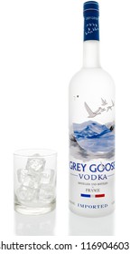 Winneconne, WI - 31 August 2018: A bottle of Grey Goose Vodka with a glass of ice on an isolated background