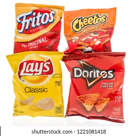 Winneconne, WI - 4 November 2018: Four Bags Of Frito Lay Chips Including Classic Potato, Doritos Nacho Cheese, Cheetos Crunchy And Fritos Original Corn Chips On An Isolated Background.