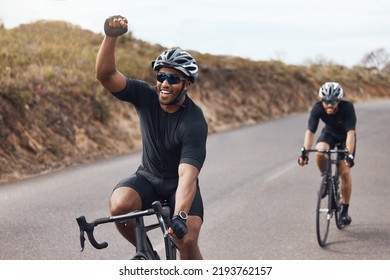 Winner, celebrating and winning cyclist cycling with his friend and racing outdoors in nature. Victory, joy and happy bicycle rider exercising on a bike for his workout routine on the road