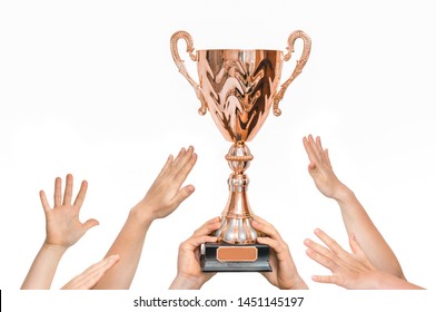 Winner Is Holding Trophy In Hands - Many Hands Raised Up. Isolated On White Background.