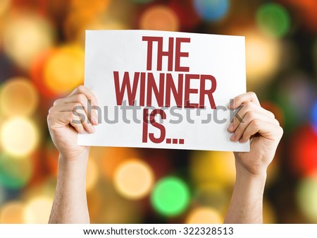 The Winner Is... placard with bokeh background
