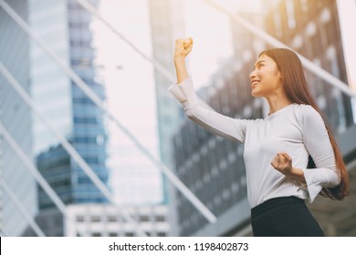 Winner Successful Business Employee Girl Rise Up Fist Hand With City Office Building Background