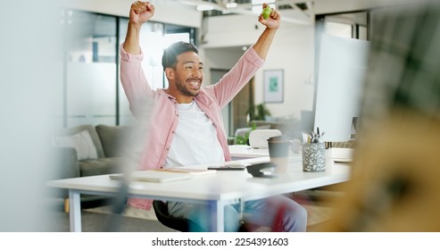 Winner, wow and cheering with a business man reaching a goal or target in his office at work. Motivation, goals and success with a male employee in celebration of a deal or promotion while working - Shutterstock ID 2254391603