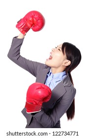 Winning business woman celebrating wearing boxing gloves and business suit. Winner and business success concept isolated on white background. asian beauty model