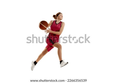 Winning final goal. Teen girl, basketball player in motion, playing isolated over white studio background. Concept of sportive lifestyle, active hobby, health, endurance, competition. Ad