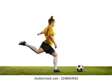 Winning goal. Young professional female football player in motion, training, playing football, soccer isolated over white background. Concept of sport, action, motion, goals, competition, hobby, ad. - Powered by Shutterstock