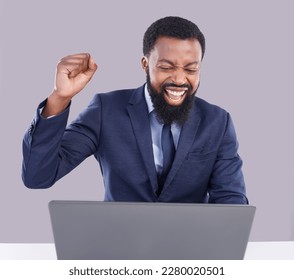 Winning, laptop and black man isolated on gray background for stock market, trading or business bonus with fist pump. Yes, success and winner person on computer sales, profit or celebration in studio