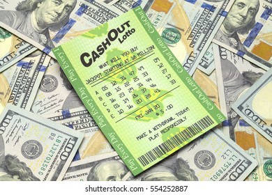 Winning Lottery Ticket with Pile of Money Isolated on White Background.