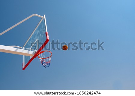 A winning score at the basketball hoop installed in a transparent fibre glass board.