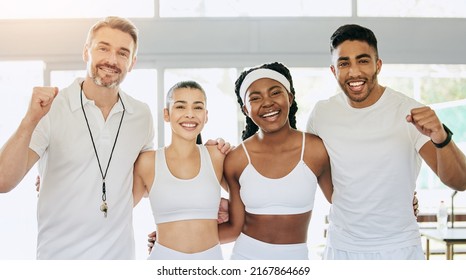 The Winning Team. Cropped Portrait Of Three Young Tennis Players And Their Coach Cheering While Standing In The Clubhouse.