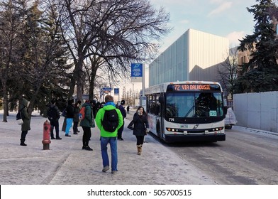 WINNIPEG, CANADA - 2014/11/19: Students waiting for a bus on the Dafoe rd bus stop in the University of Manitoba. 
