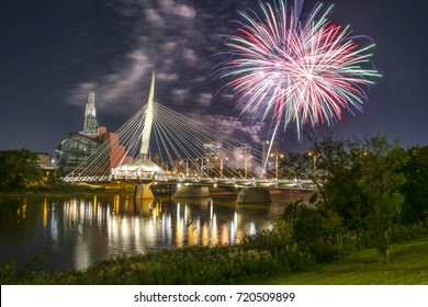 WINNIPEG, CANADA - AUGUST 5, 2017 ; Fireworks above the bridge and the river.