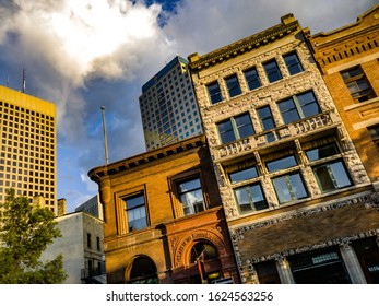 WINNIPEG, CANADA - JULY 27TH 2018: Portage and Main's towers Winnipeg can be see behind the beautiful brick buildings of the Exchange District.