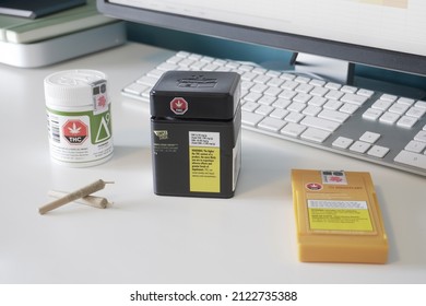 Winnipeg, Manitoba, Canada - February 12, 2022: Legal Weed Products and Joints on a Desk.