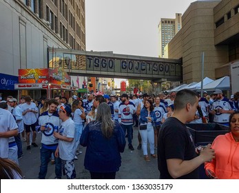 Winnipeg, Manitoba / Canada - May 12 2018: Fans Celebrating At The Winnipeg Jets Whiteout Street Party During The NHL Stanley Cup Playoffs