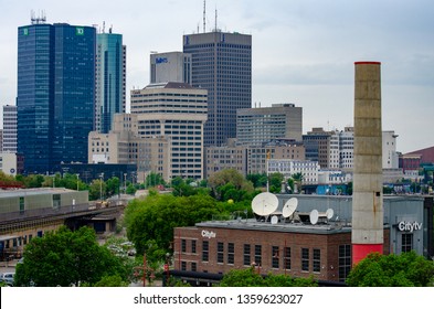 Winnipeg, Manitoba / Canada - May 27 2018: View of Downtown Winnipeg with The Forks Historical Site in the Foreground