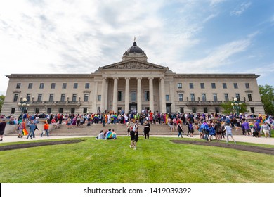 Winnipeg, Manitoba/Canada - June 2019: People are assembled in front of the Manitoba Legislative Building to kick off the Pride Parade in Winnipeg for Pride Month 2019