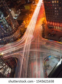 Winnipeg, Manitoba/Canada - October 2019: Aerial view of Winnipeg's iconic intersection, Portage and Main at night, with light trails of vehicles passing by