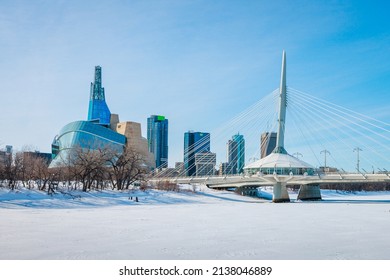 Winnipeg, MB, Canada - March 2022: The Canadian Museum for Human Rights and the Esplanade Riel over the frozen Red River during winter