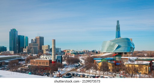 Winnipeg, MB, Canada - March 2022: View of the Canadian Museum of Human Rights and downtown Winnipeg from the Forks on a clear winter day