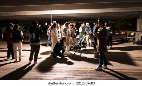 Winnipeg, MB, Canada - September 2022: People Looking At An Art Installation At The Forks Parking Lot During Nuit Blanche