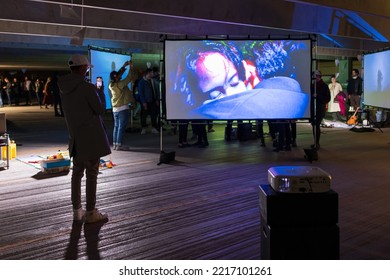 Winnipeg, MB, Canada - September 2022: Person Taking A Photo Of An Art Installation At The Forks Parking Lot During Nuit Blanche