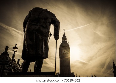 Winston Churchill's statue with Big Ben in the background in dark vintage sunrise