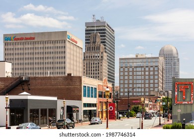 WINSTON-SALEM, NC, USA-1 JUNE 2021: A view of the city skyline , including the Reynolds Plaza building, the original Reynolds building, the Winston Tower, and Wells Fargo Center. Horizontal image.