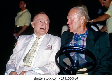 Winston-Salem, North Carolina USA, May 31, 1991
Bob Hope sitting with Former President Gerald R. Ford ride together in a golf cart to the stage during the annual Bing Crosby Clambake Golf Tournament 