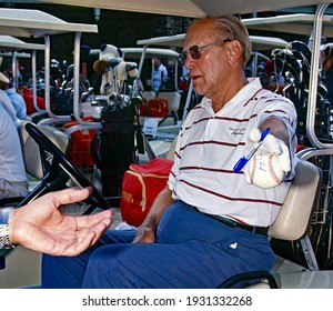 Winston-Salem, North Carolina USA, May 31, 1991
Former President Gerald R. Ford signing autograph on a baseball at the annual Bing Crosby Clambake Golf Tournament at the Bermuda Run Country Club. 