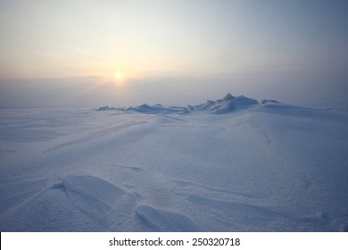 Winter Antarctica Landscape. Plain Of Snow, Ice And Low Northern Sun