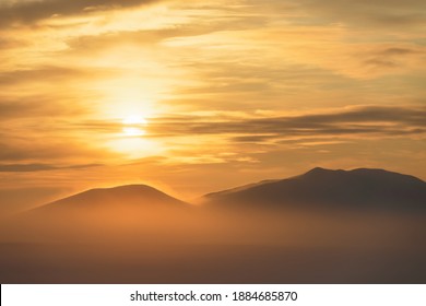 Winter Arctic Landscape. Beautiful Sunset Over The Tundra And The Snow-capped Mountain. Nature Of Siberia And The Russian Far East. Cold Frosty Winter Weather. Chukotka, Far North Of Russia, Arctic.