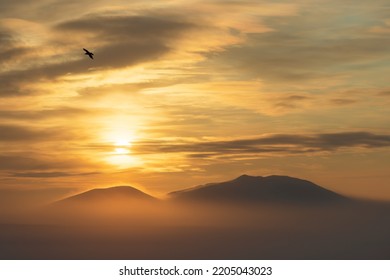 Winter Arctic Landscape. Beautiful Sunset Over The Tundra And The Snow-capped Mountain. Cold Frosty Winter Weather. Nature Of Siberia And The Russian Far East. Chukotka, Far North Of Russia, Arctic.