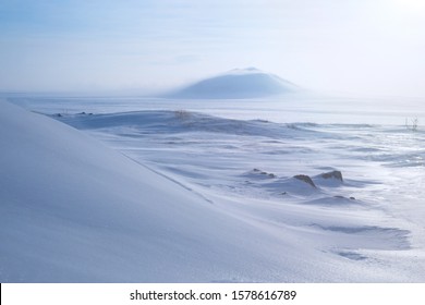 Winter arctic landscape with snow covered tundra and hills. Very cold frosty weather in April in the far north of Russia. Location place: Chukotka, Siberia, Russian Far East. Polar region. - Shutterstock ID 1578616789