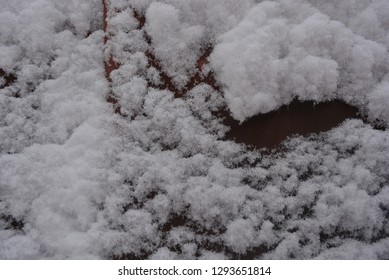 Winter Background, Adhering Snow, Beautiful Cut Of Large Snow On A Metal Construction Sheet With Mounds And Hollows