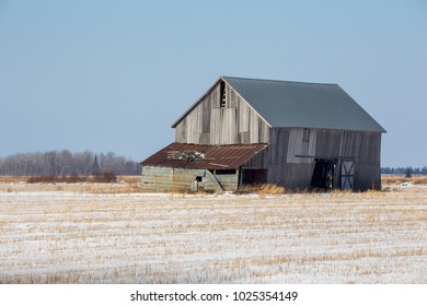 Winter barn in field