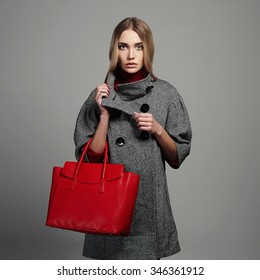 Winter Beautiful Woman With Handbag.Beauty Fashion Girl In Topcoat.Shopping