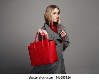 Winter Beautiful Woman With Handbag.Beauty Fashion Girl In Topcoat.Shopping