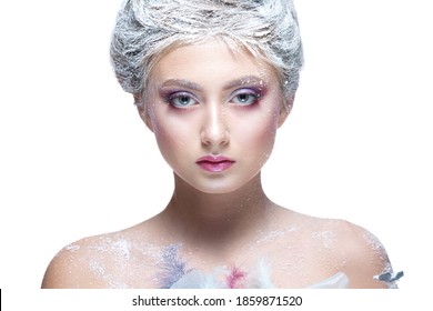 Winter Beauty Woman in clothes made of frozen flowers covered with frost, with snow on her face and shoulders. Christmas Girl Makeup. Make-up the snow Queen. Isolated on a white background. Close-up.